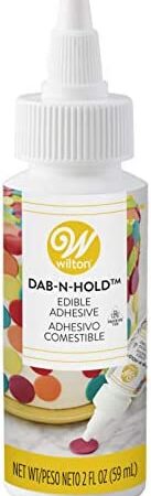 Wilton Dab-N-Hold Edible Adhesive, 2fl.oz (Packaging may vary)